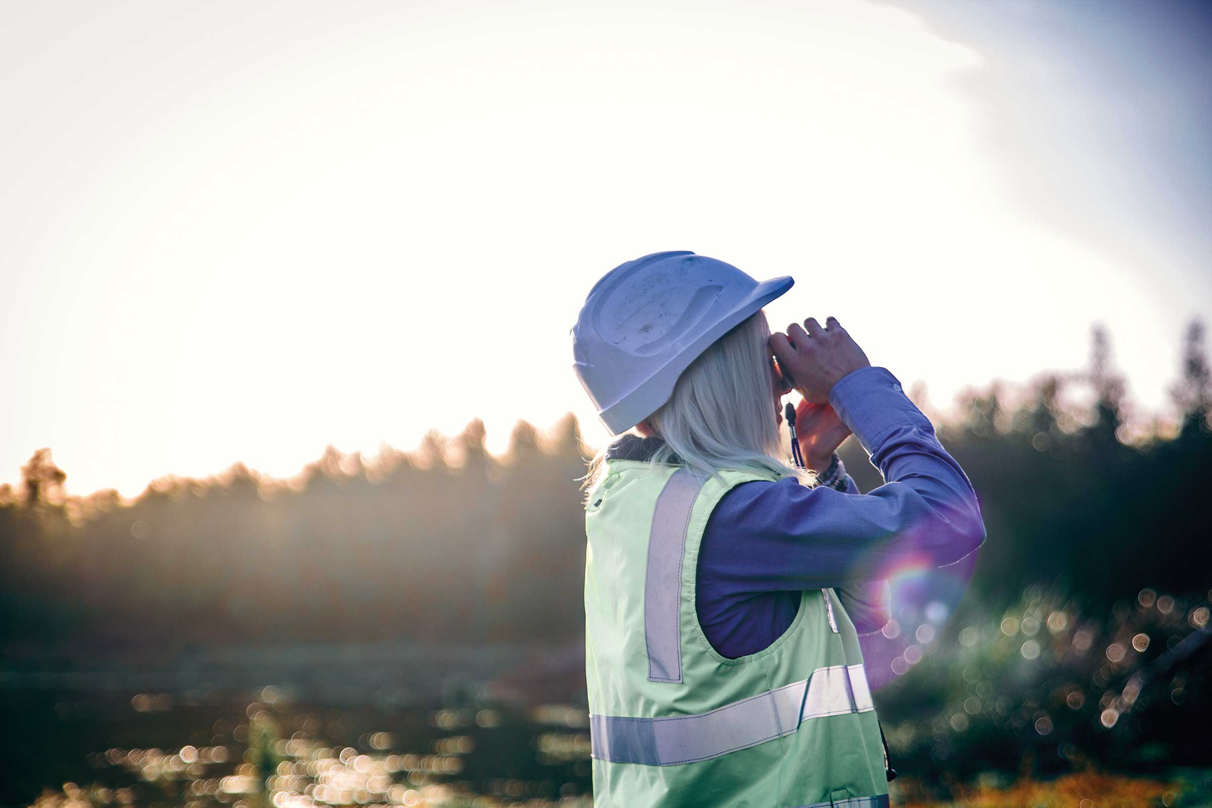 Person looking through binoculars | Carbon Farming | ActivAcre Tasmania