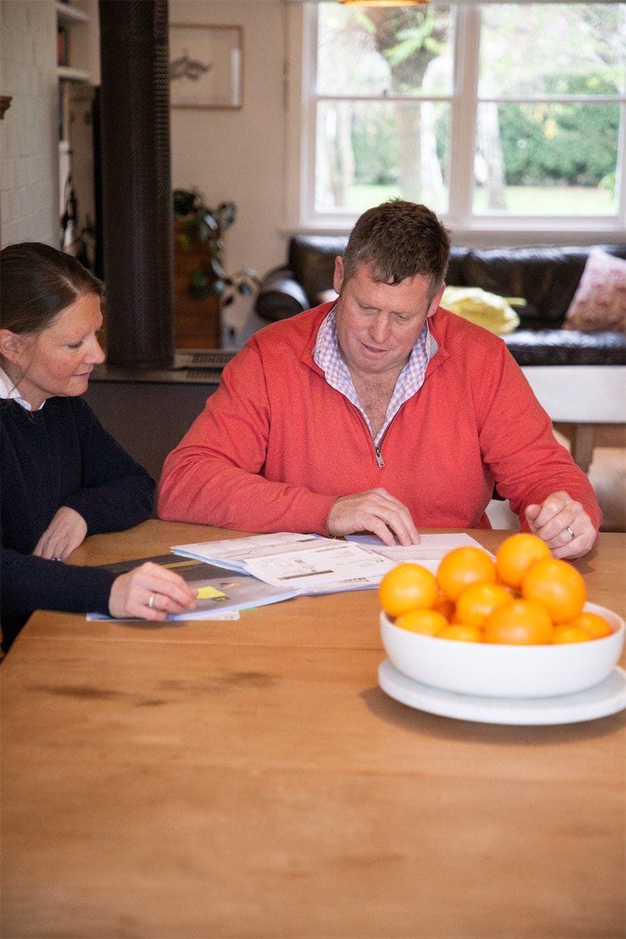 Two people at table with paperwork | Carbon Farming | ActivAcre Tasmania