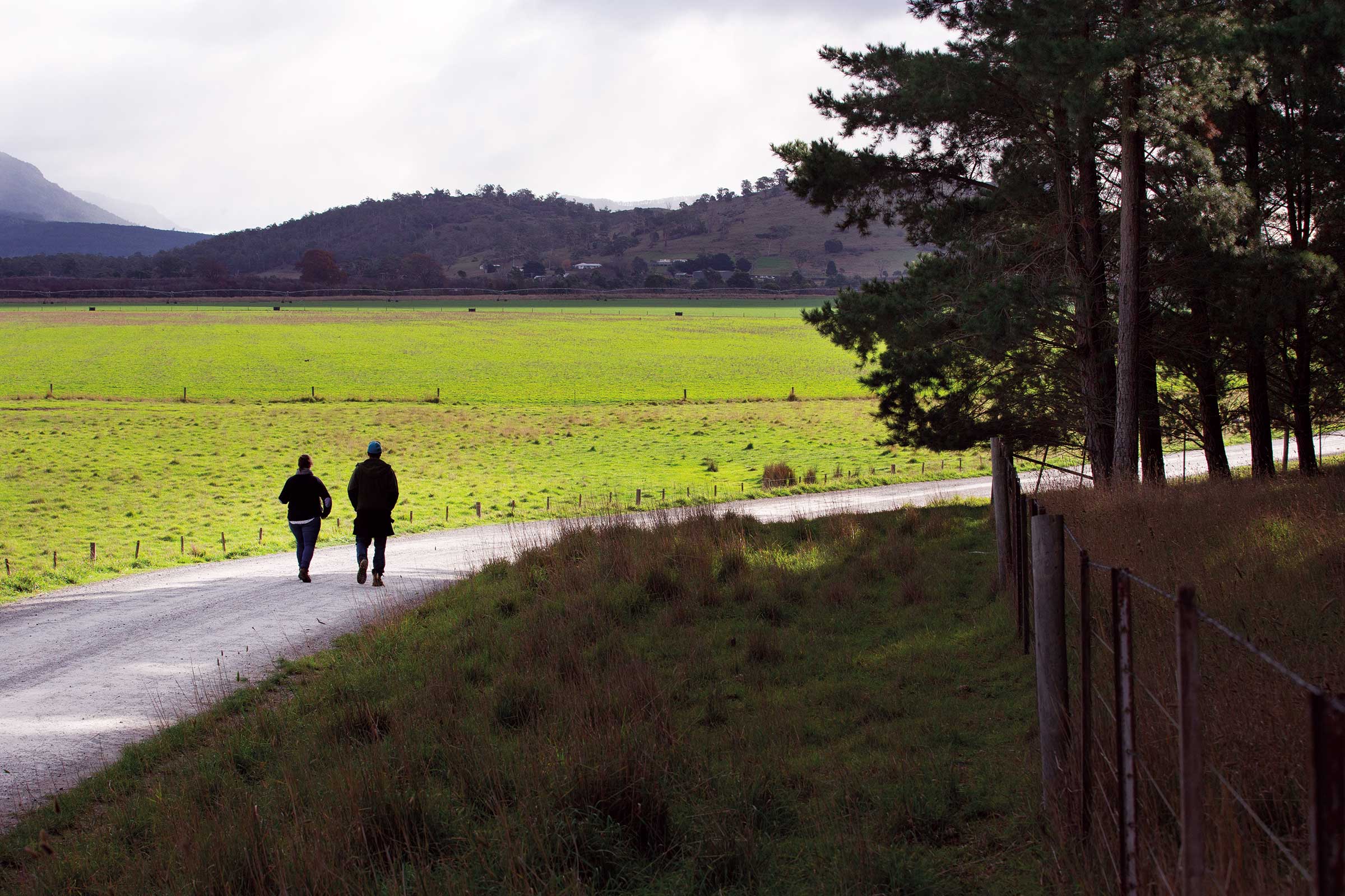 Two people walking next to water | Carbon Farming | ActivAcre Tasmania